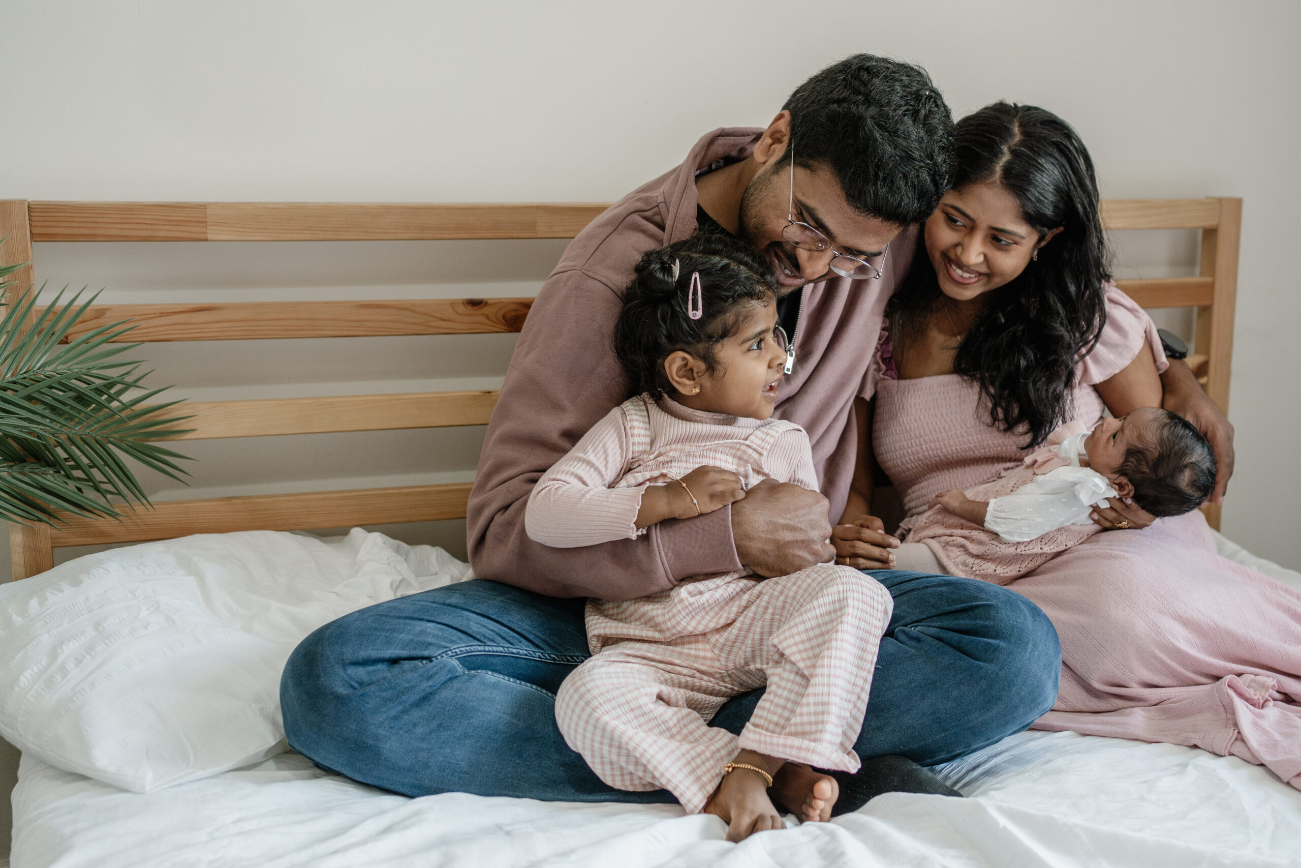 cuddled on bed during at-home photography session in Nottingham
